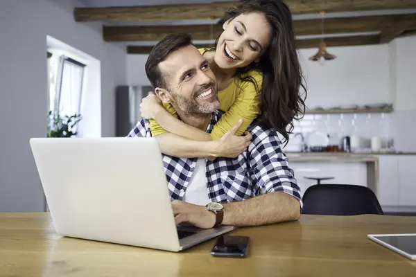 happy-couple-sitting-at-dining-table-embracing-u-2022-03-08-01-04-03-utc