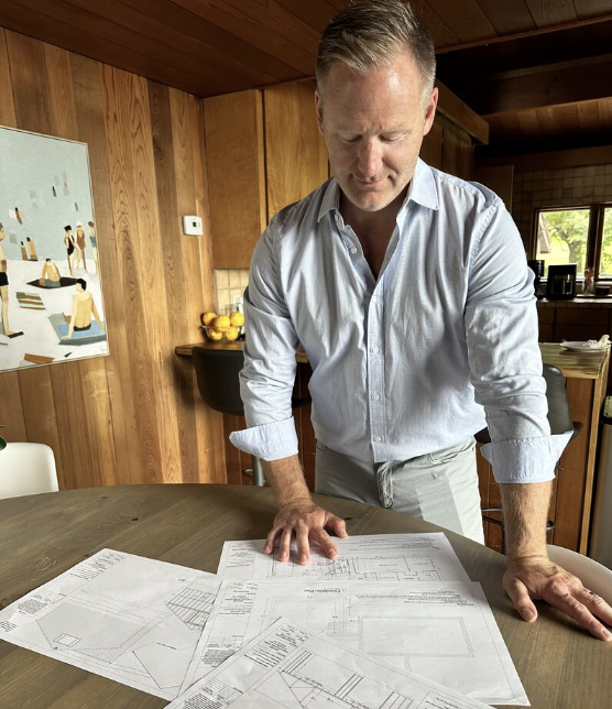 Agent Looking Over Plans