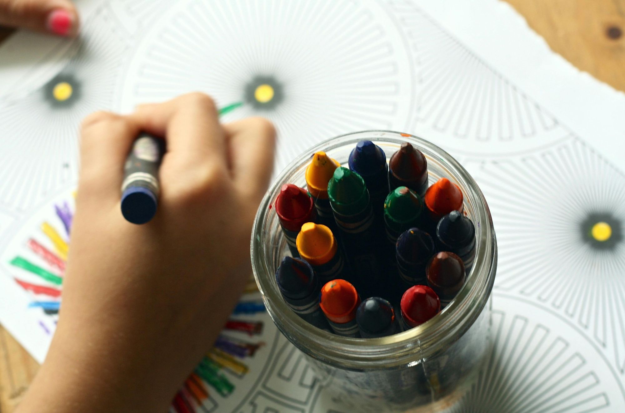 Kids in school colouring in a book - Coombs, BC