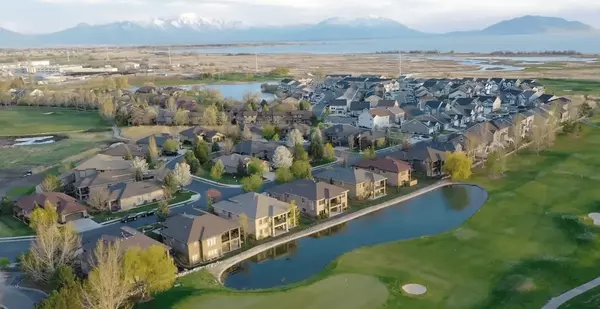 Aerial drone view of a Salt Lake City neighborhood, capturing the scenic community and home exterior for Deadman Realty’s marketing.