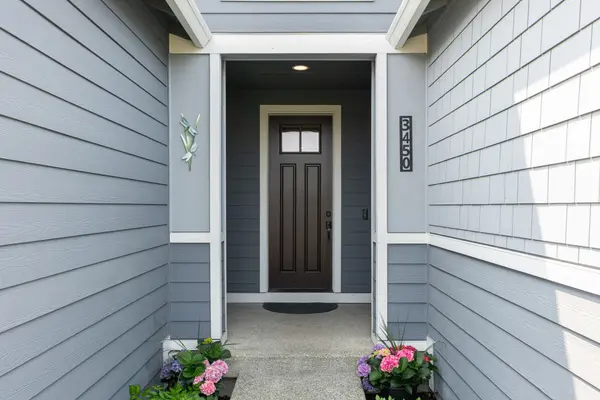 Inviting front door of a home featured in an open house in Maple Valley, WA. Explore upcoming open houses with Gatz Home Group and find your perfect home in Maple Valley, Kent, and Covington.