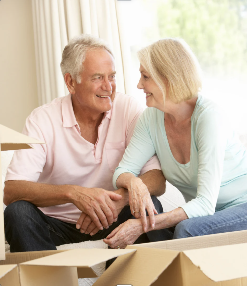 Couple packing and discussing moving 