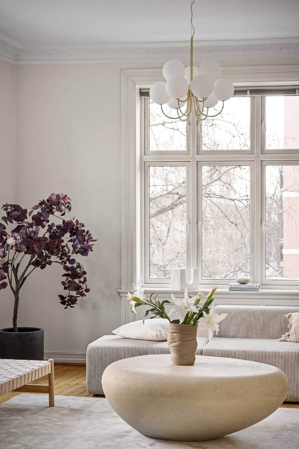 Bright room with large windows and flowers