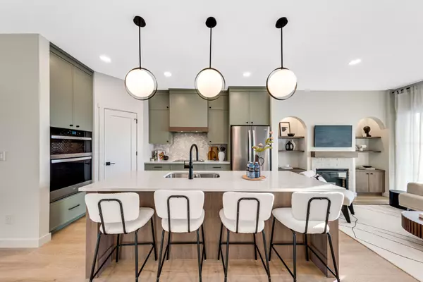 Spacious open-concept bungalow in Chateau, Saskatoon. High-end finishes, quartz countertops, and designer lighting.