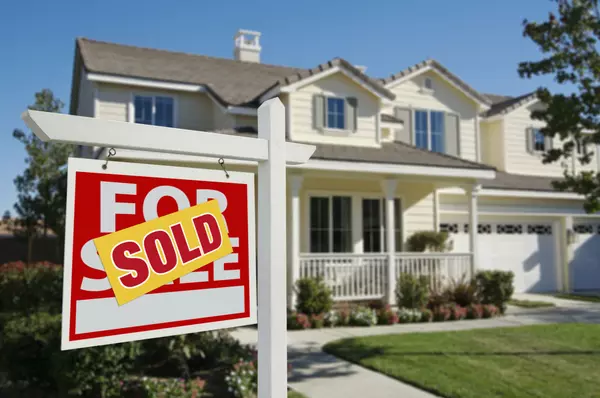Sold Home For Sale Sign and House