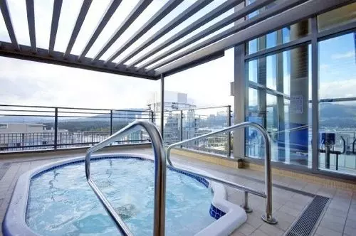 beautiful views on the rooftop hot tub at the cielo at 1205 west hastings street in coal harbour