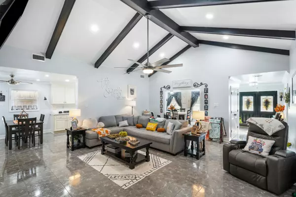 This large living room with vaulted celling and an open flow will wow all of your friends and family. Large fireplace